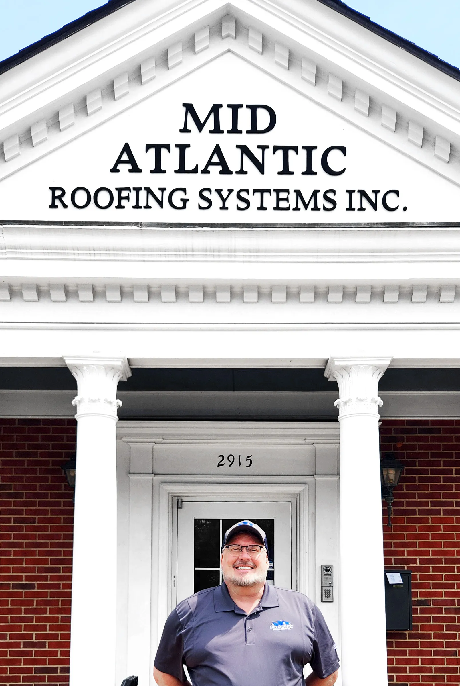 John Harrington, owner of Mid Atlantic Roofing Systems, standing in front of the Winston-Salem office
